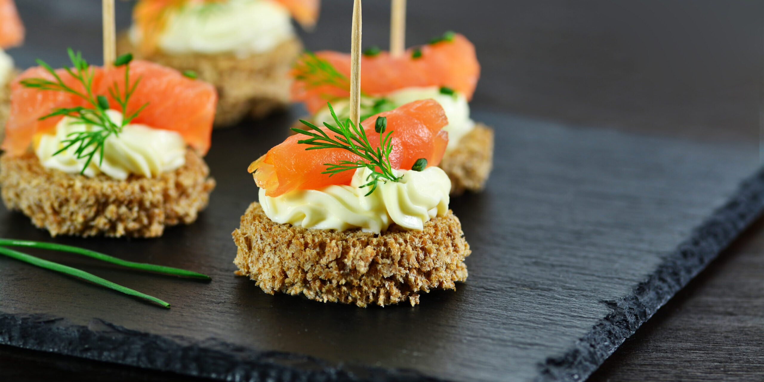Smoked,Salmon,Canapes,With,Cheese,Cream,And,Dill,On,Brown